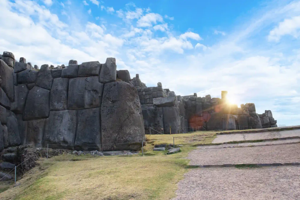 The colossal Inca stone walls above Cusco lit by the late-day sun
