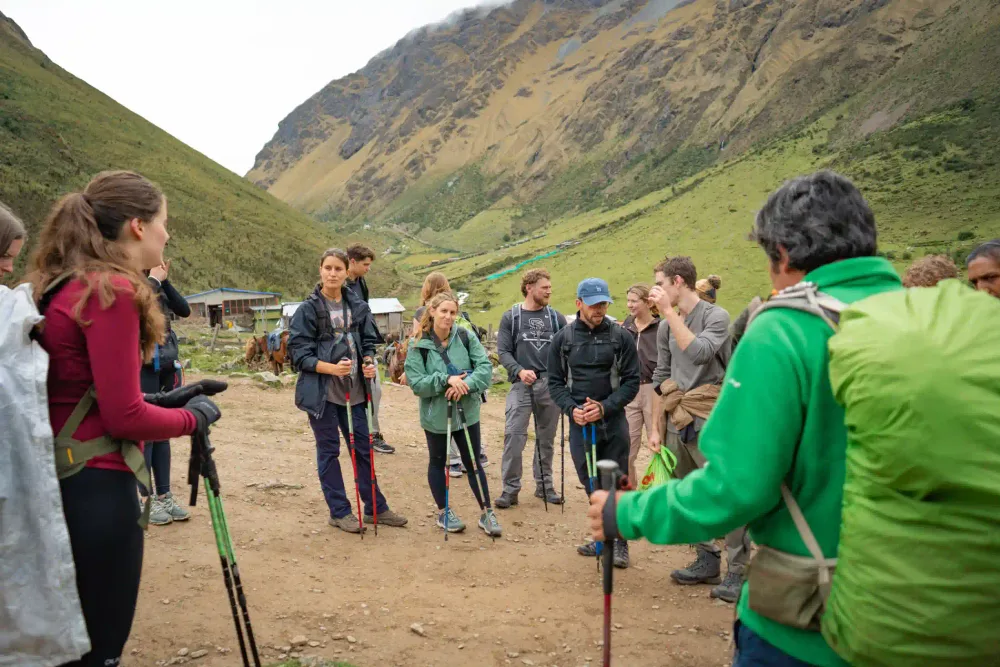 The local guide briefing travelers in the valley below Humantay