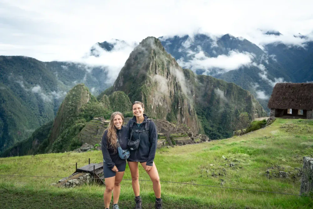 Travelers exploring Machu Picchu with a guide