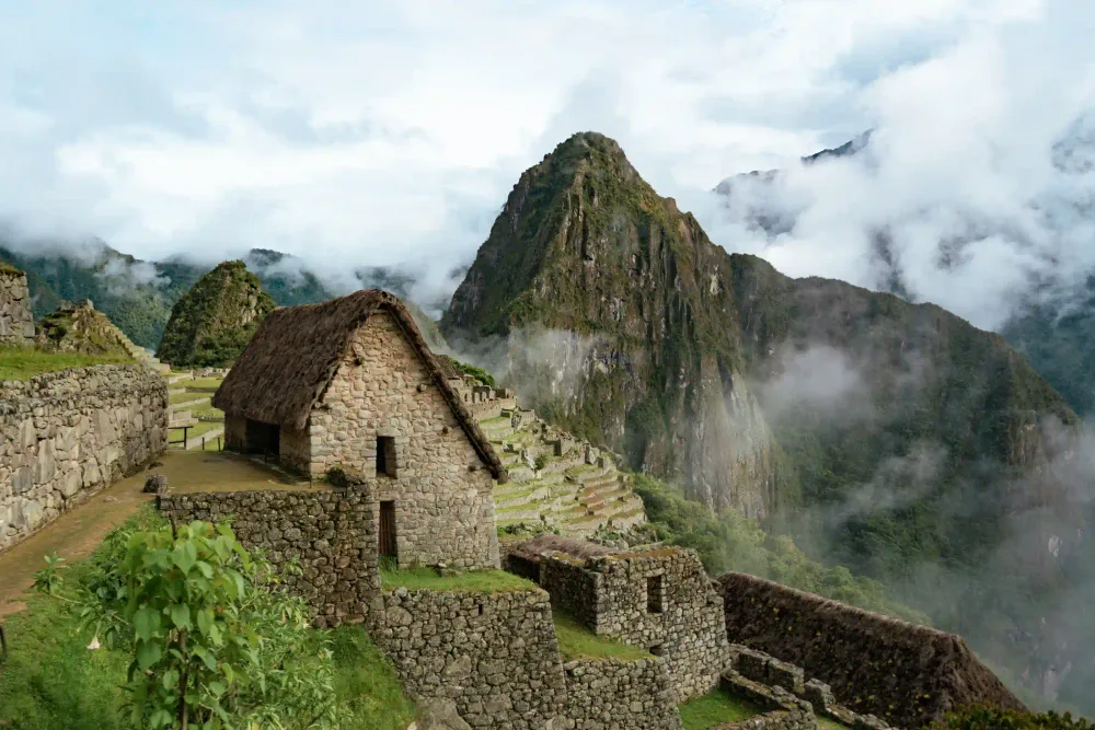 Machu Picchu citadel with Huayna Picchu in the clouds