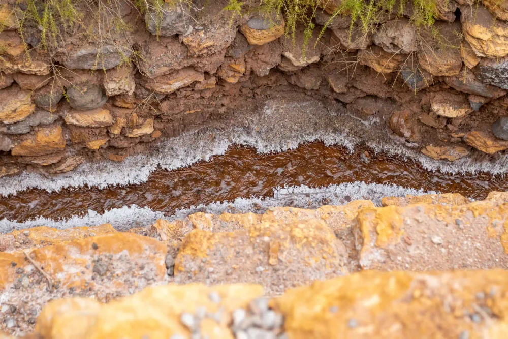 Salt crystallising along the natural spring that feeds the Maras pools