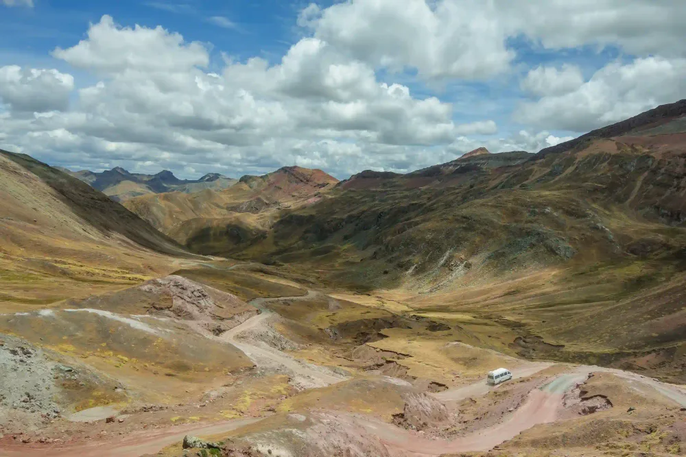 The wide colourful valley on the way to Palcoyo Mountain