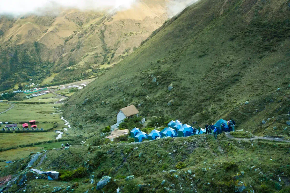 Trekkers at the 4,650 m Salkantay Pass below Nevado Salkantay